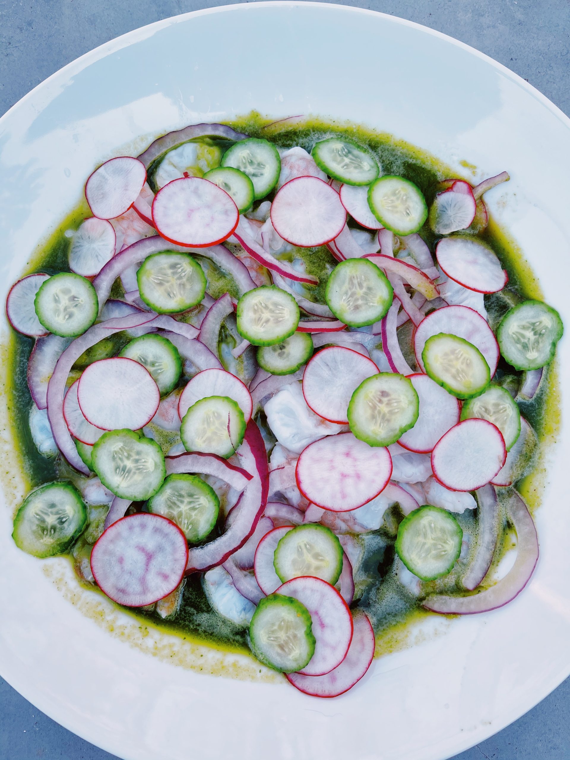 Aguachile de Camaron plated on a clean white plate